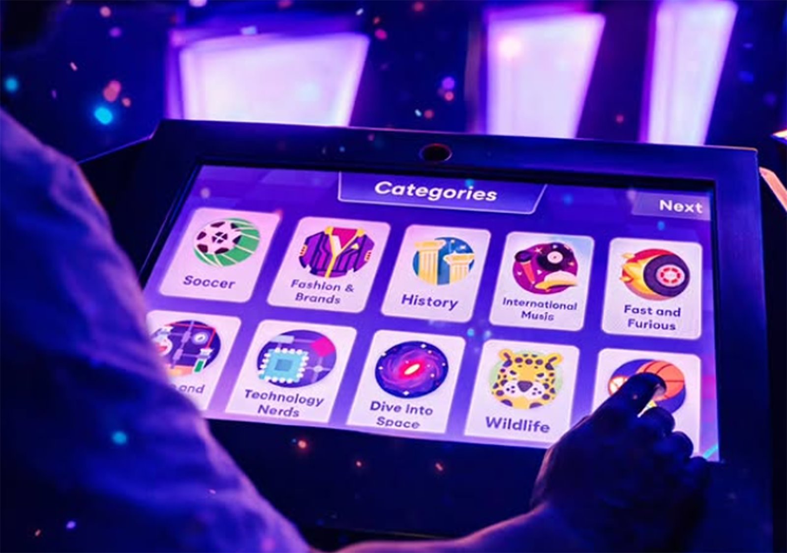 The Game of Minds quiz platform shown on a touchscreen category selection screen